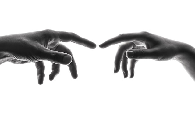 2 fingers from different people about to touch