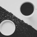 yin and yang in the form of white and black cup contents