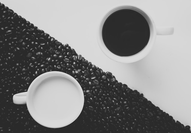 yin and yang in the form of white and black cup contents